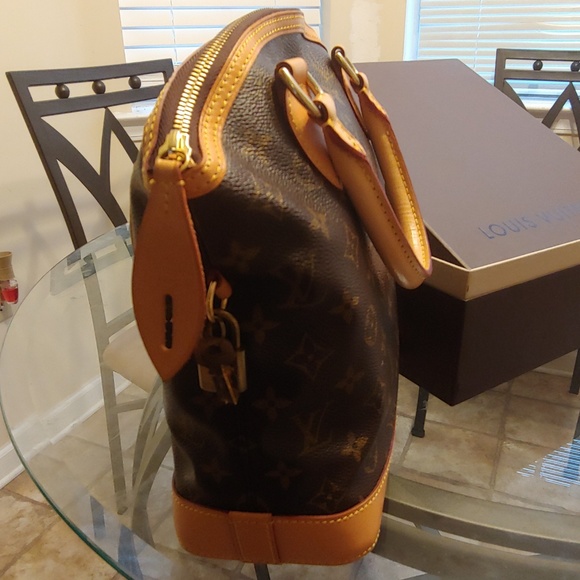 Authentic Louis Vuitton Lock it Handbag - Picture 3 of 8